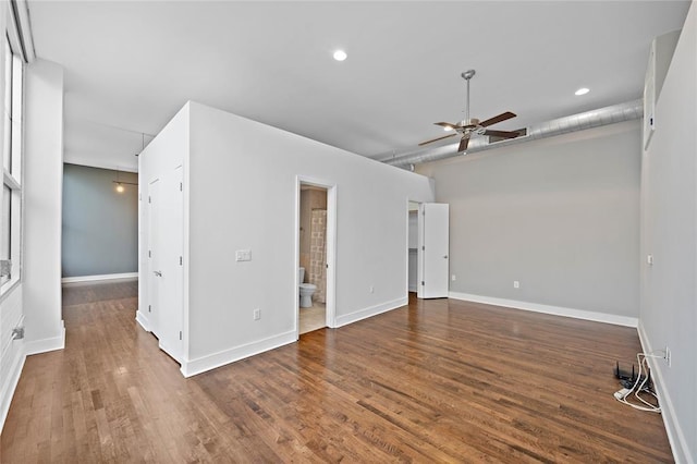 unfurnished room with dark hardwood / wood-style flooring and ceiling fan