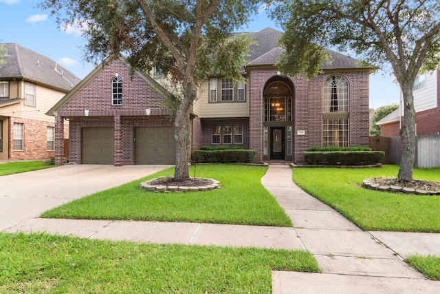 view of front of property featuring a garage and a front lawn