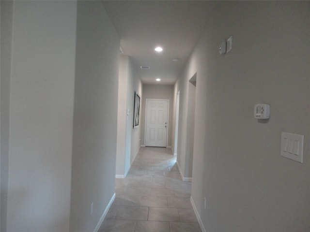 corridor with light tile patterned flooring