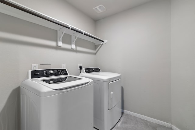 washroom with washing machine and dryer