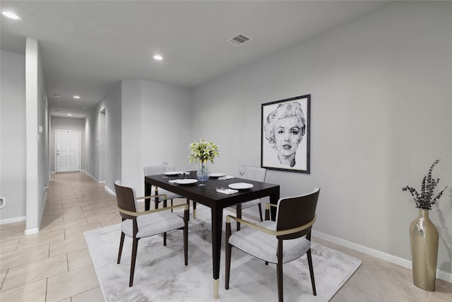 dining space with light tile patterned floors