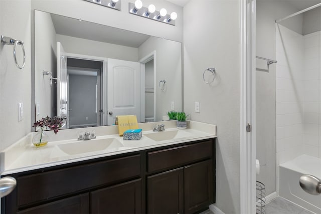 bathroom with tile patterned flooring, bathing tub / shower combination, and vanity