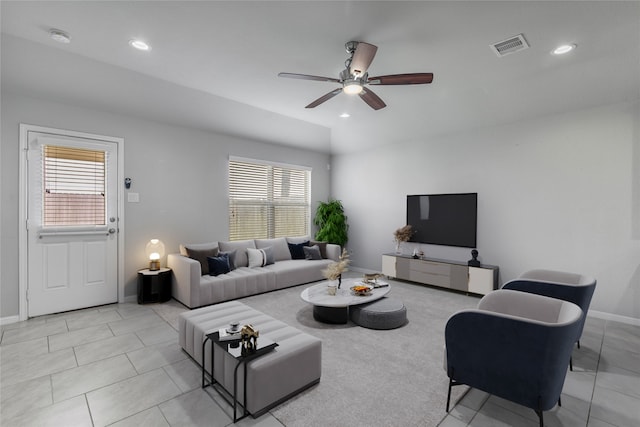 living room with a wealth of natural light and ceiling fan