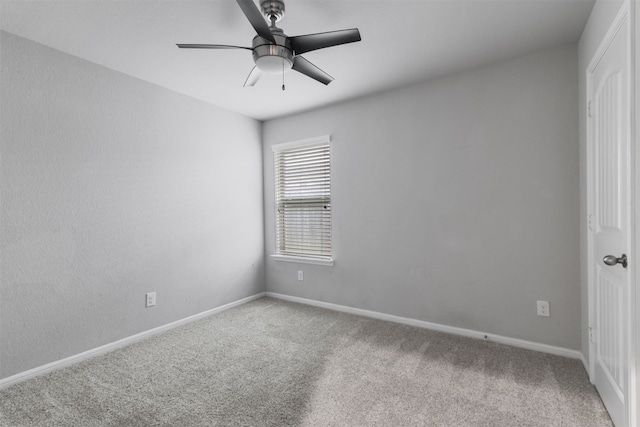 spare room with carpet and ceiling fan