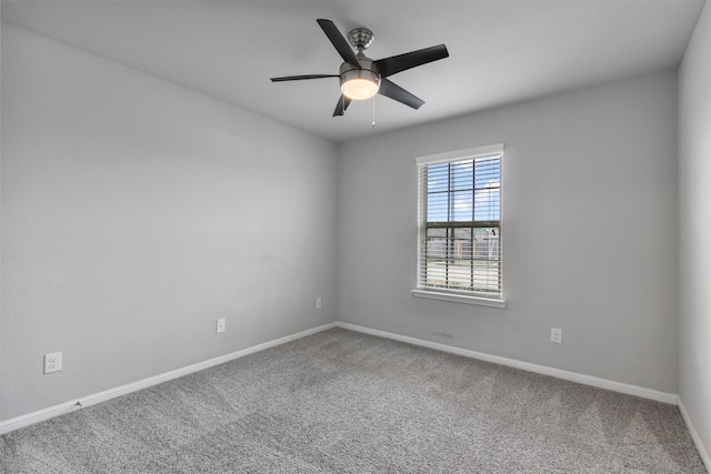 spare room with carpet and ceiling fan