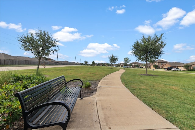 surrounding community featuring a lawn