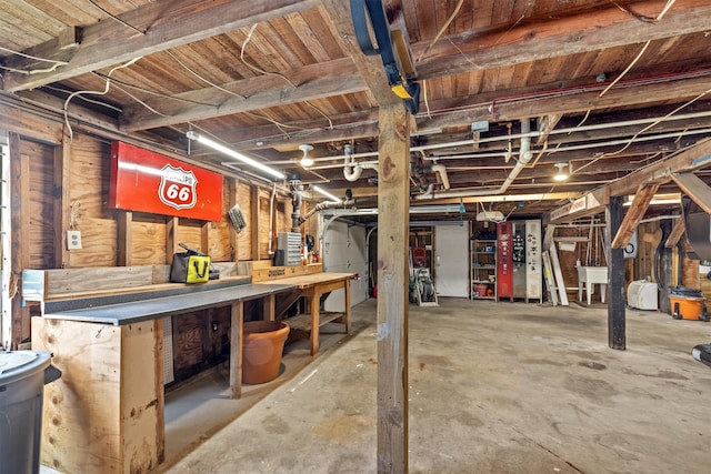 basement featuring a workshop area and sink