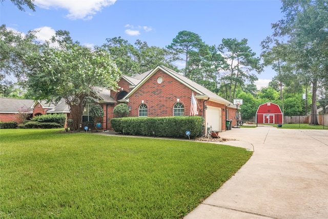 view of front of home featuring a front yard and a shed