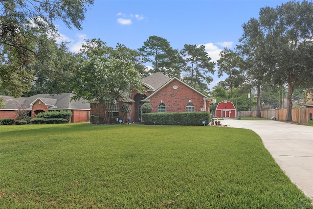 single story home featuring a front lawn