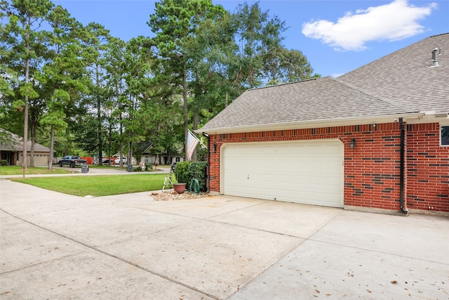 view of side of property with a garage