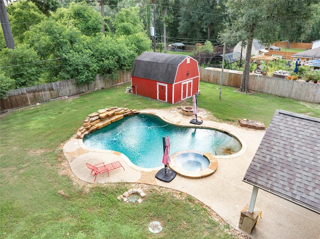 view of swimming pool featuring a shed, a lawn, a patio, and an in ground hot tub