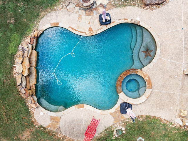 view of swimming pool featuring a patio area