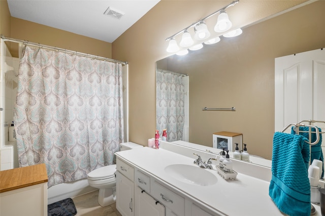 full bathroom featuring vanity, tile patterned floors, toilet, and shower / tub combo with curtain