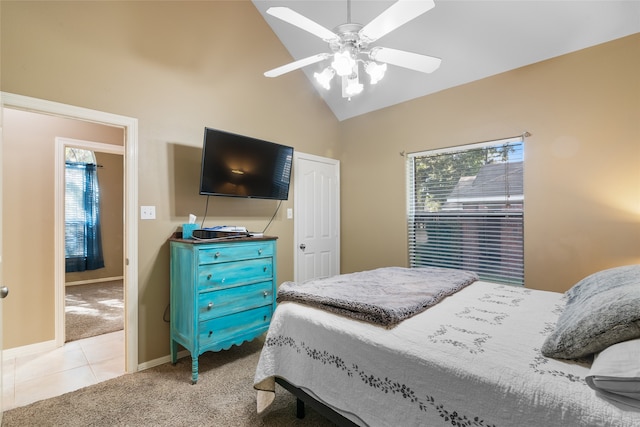 carpeted bedroom with high vaulted ceiling and ceiling fan