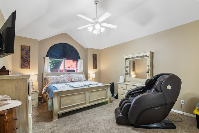 carpeted bedroom with vaulted ceiling and ceiling fan