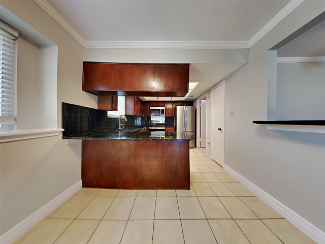 kitchen featuring ornamental molding, appliances with stainless steel finishes, kitchen peninsula, and sink