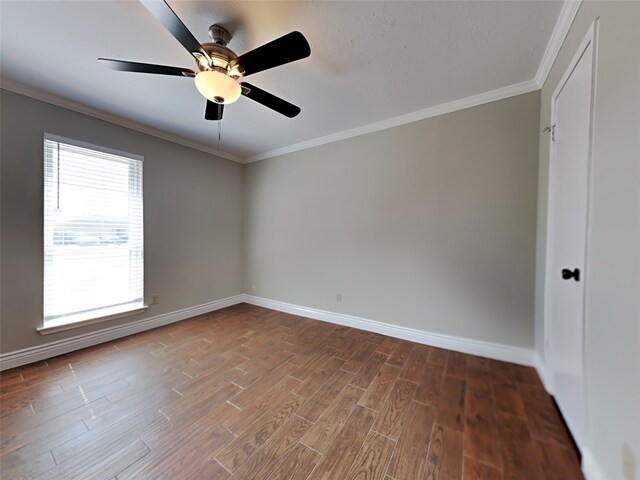 unfurnished room with crown molding, hardwood / wood-style flooring, and ceiling fan