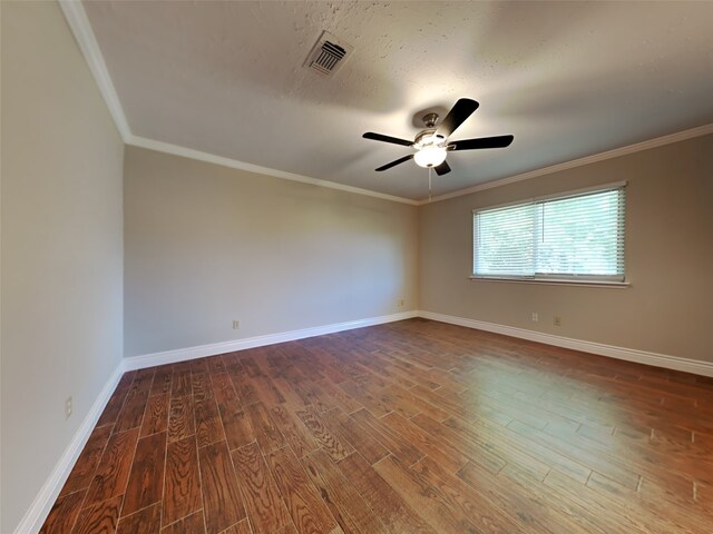 unfurnished room with ornamental molding, dark hardwood / wood-style floors, and ceiling fan