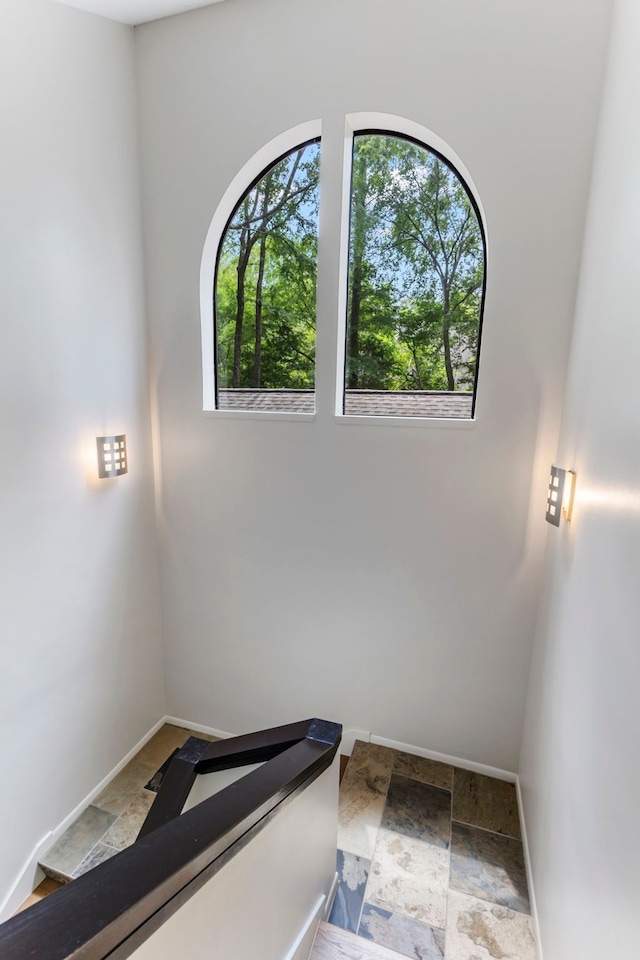 stairs with light tile patterned floors