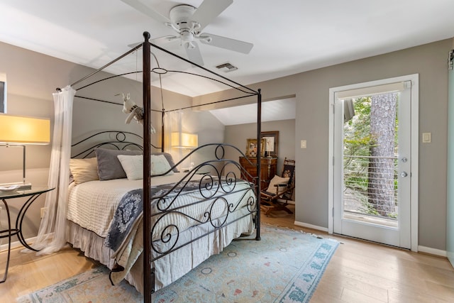 bedroom with light hardwood / wood-style flooring, ceiling fan, and access to exterior