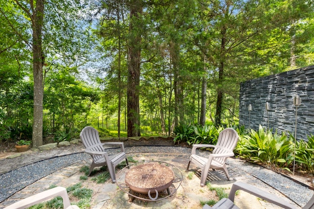 view of patio / terrace featuring an outdoor fire pit