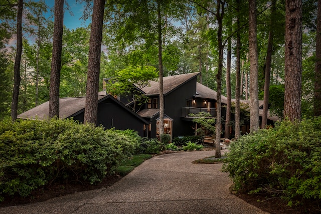 view of side of property with a balcony