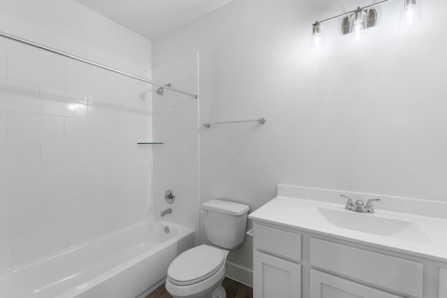 full bathroom featuring vanity, toilet, and tiled shower / bath