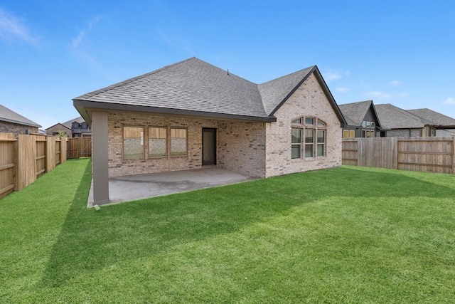 back of property featuring a patio and a yard