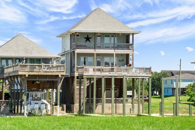 rear view of house with a lawn