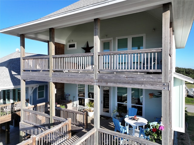 rear view of property with a balcony