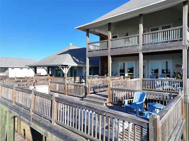 exterior space featuring a deck and a balcony