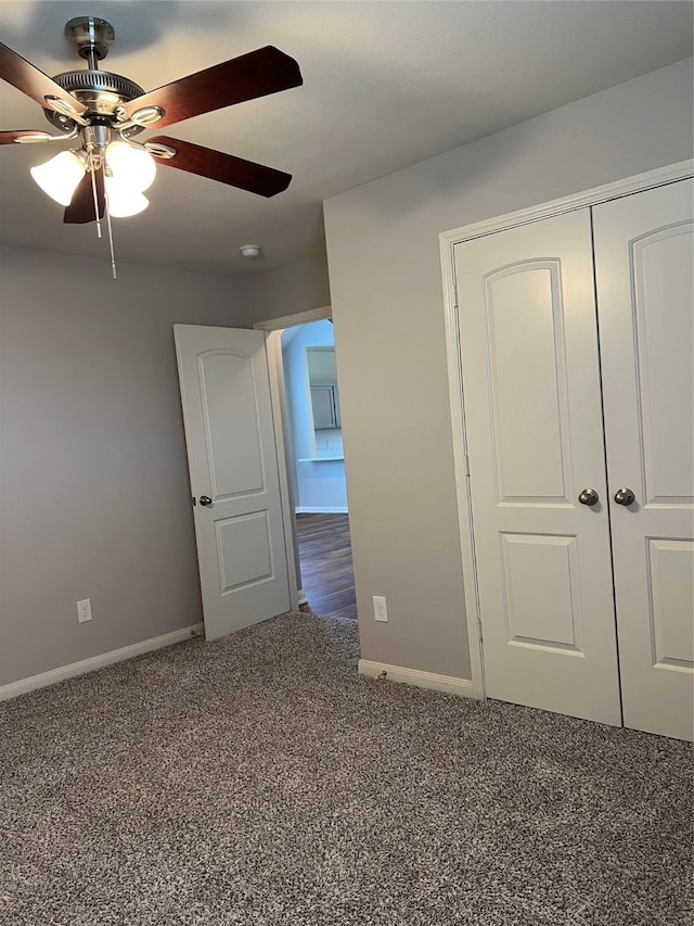 unfurnished bedroom with a closet, ceiling fan, and carpet floors