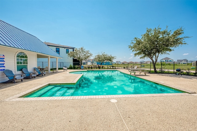 view of swimming pool featuring a patio