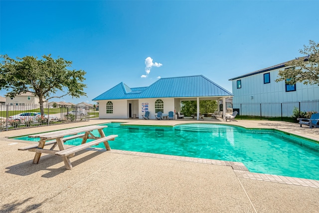 view of swimming pool with a patio