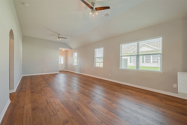 spare room with wood-type flooring, vaulted ceiling, and ceiling fan