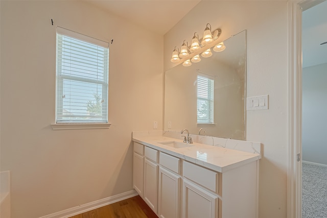 bathroom featuring vanity and hardwood / wood-style flooring