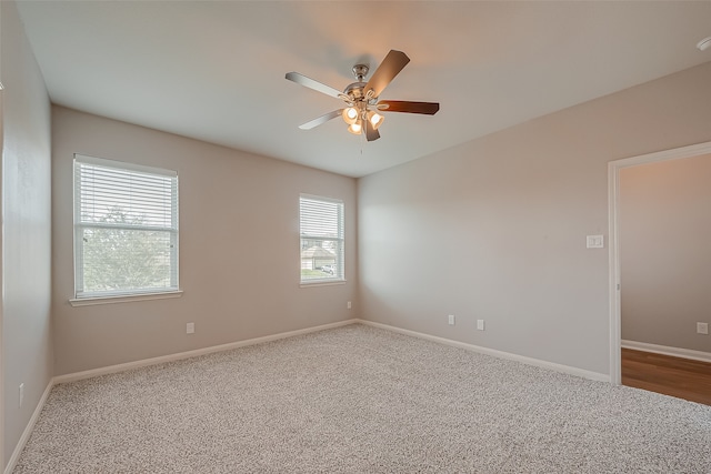 carpeted empty room with ceiling fan