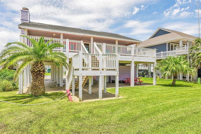 back of house featuring a patio area, a yard, and a wooden deck