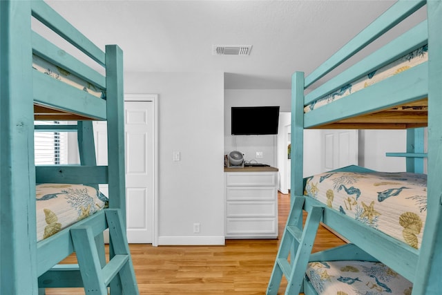 bedroom featuring light wood-type flooring