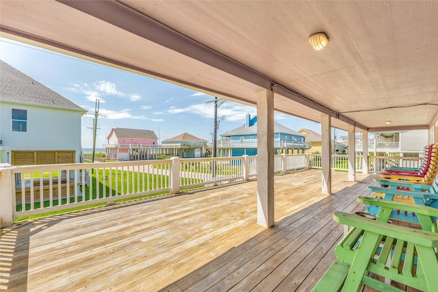 wooden deck with a yard