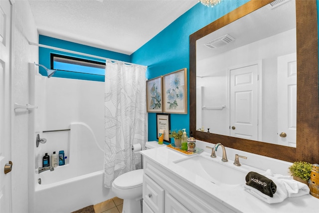 full bathroom featuring tile patterned floors, toilet, a textured ceiling, vanity, and shower / bath combo