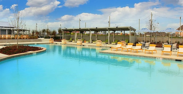 view of swimming pool featuring a patio