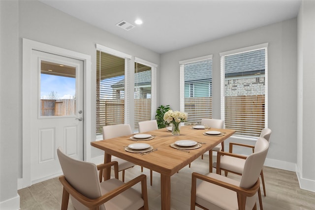 dining area with light hardwood / wood-style floors