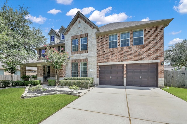 view of front of house with a garage and a front yard