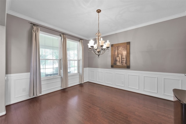 unfurnished dining area with an inviting chandelier, dark hardwood / wood-style floors, and ornamental molding