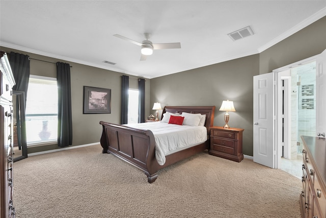 carpeted bedroom with ceiling fan and crown molding