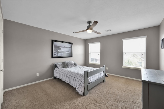 bedroom featuring light carpet and ceiling fan