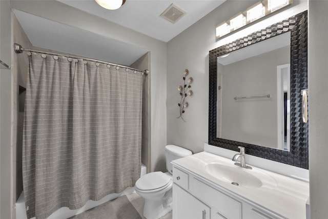 full bathroom with shower / tub combo, toilet, and vanity