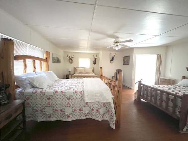 bedroom featuring dark wood-type flooring and ceiling fan