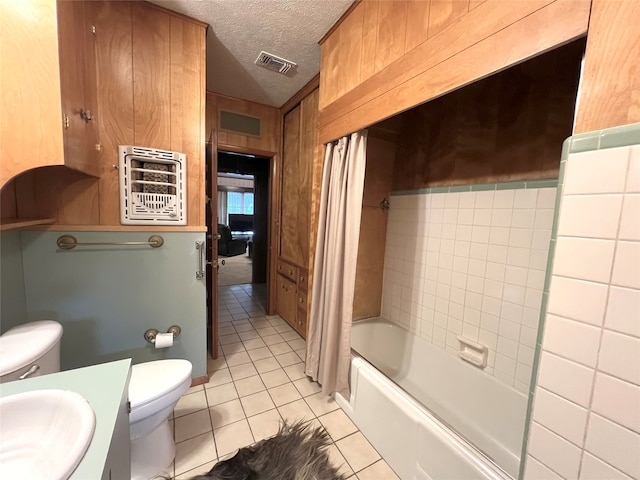 full bathroom with vanity, toilet, heating unit, shower / bath combo with shower curtain, and tile patterned flooring